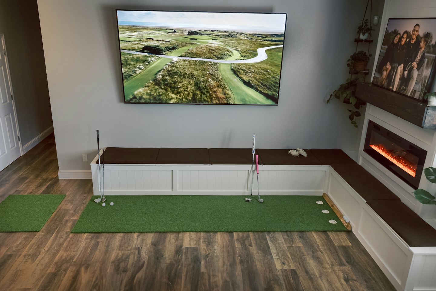 Golf putting mats arranged on a living room floor.